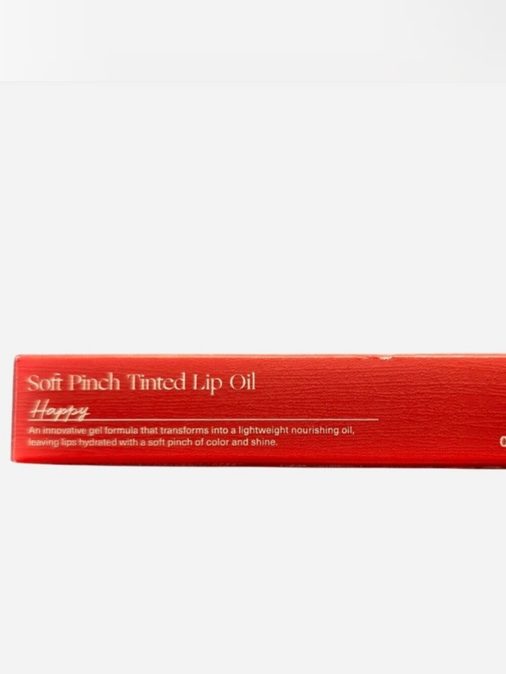 Rare Beauty Tinted Lip Oil in "Happy" Shade